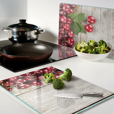 Glas schneidebrett Kirschen auf Holzgrund