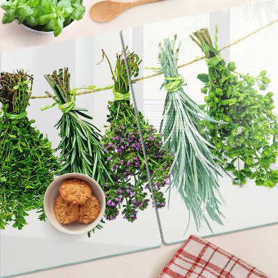 Schneidebrett glas Getrocknete Kräuter an einer Schnur