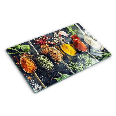 Glas schneidebrett Gewürze in Löffeln