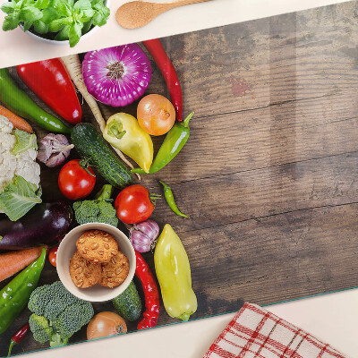 Glas schneidebrett Gemüse auf Holzgrund