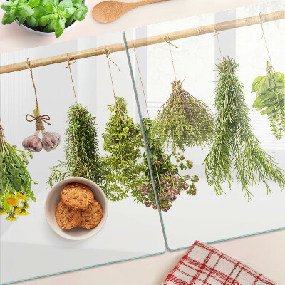 Schneidebrett mit Motiv hängender Kräuterbündel