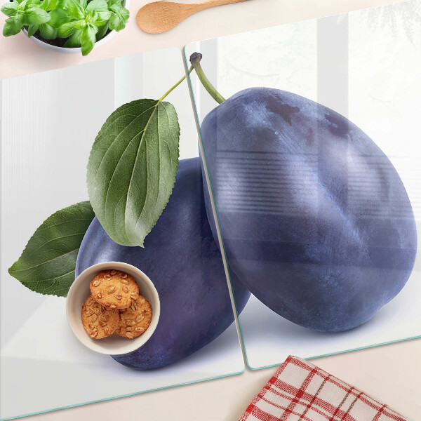 Schneidebrett mit Motiv von Pflaumen und Blättern