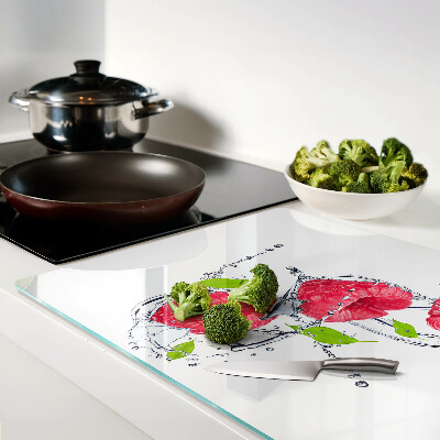 Glas Schneidebrett mit Motiv aus Himbeeren im Wasser und Blättern