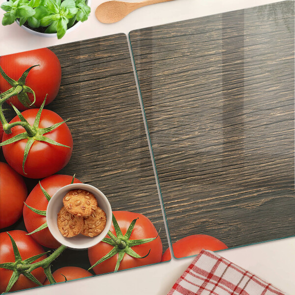 Schneidebrett mit Motiv von Tomaten auf Holzgrund