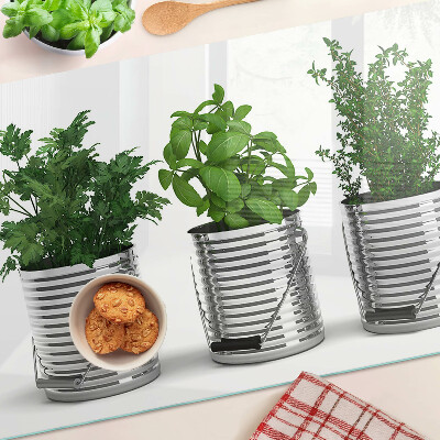 Schneidebrett mit Motiv von Pflanzen in Metalltöpfen