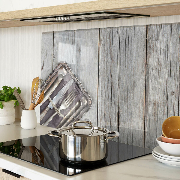 Glas Schneidebrett mit rustikalem Besteck auf Holzhintergrund