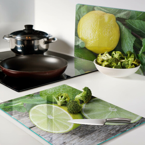 Schneidebrett glas Zitronen und Limetten mit Minze