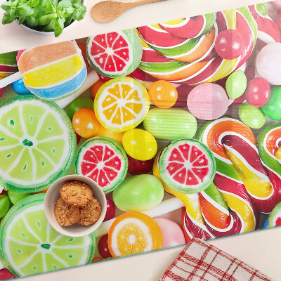 Glas-Schneidebrett mit Motiv aus Süßigkeiten und Früchten