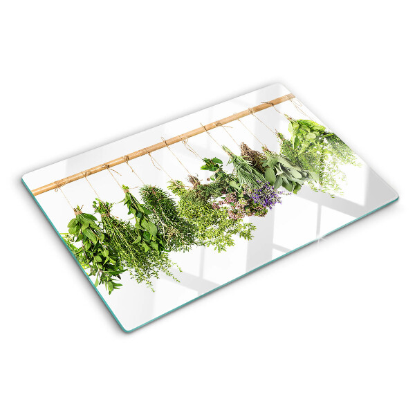 Schneidebrett Glas mit getrockneten Kräutern an einer Schnur