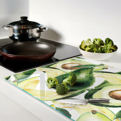 Glas schneidebrett Avocado mit Blättern im Hintergrund