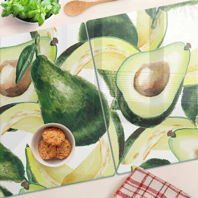 Glas schneidebrett Avocado mit Blättern im Hintergrund