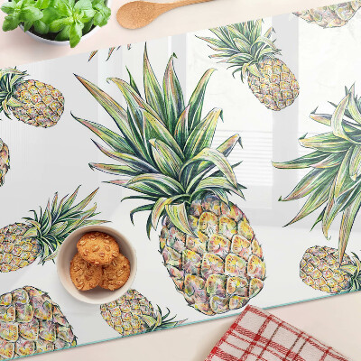 Schneidebrett Glas mit Motiv einer Ananas vor weißem Hintergrund