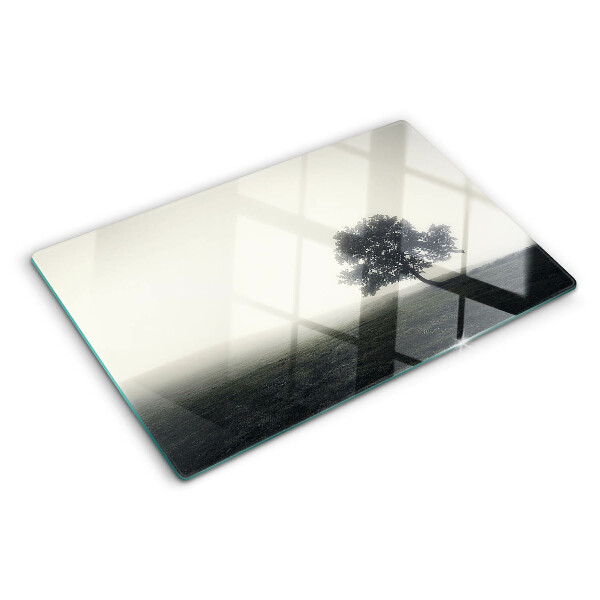 Schneidebrett glas Ein Baum in einer nebligen Landschaft
