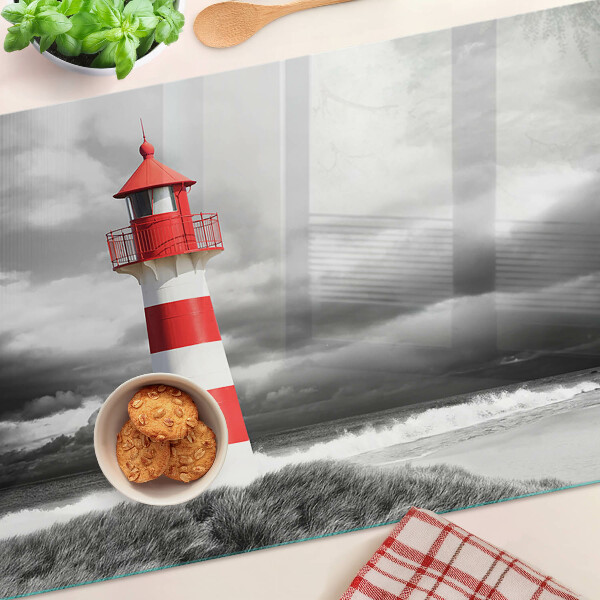 Schneidebrett Glas mit Motiv eines Leuchtturms in einer Landschaft