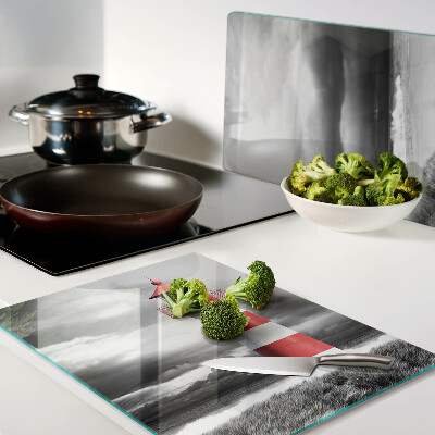 Schneidebrett Glas mit Motiv eines Leuchtturms in einer Landschaft