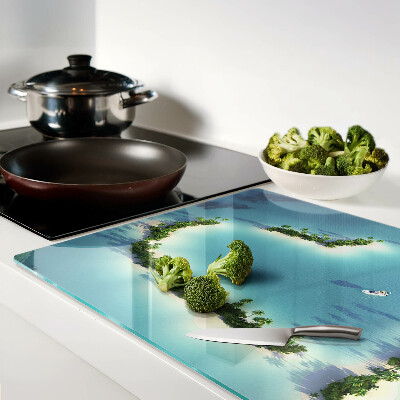 Glas-Schneidebrett mit einem Motiv einer paradiesischen Insel und Palmen