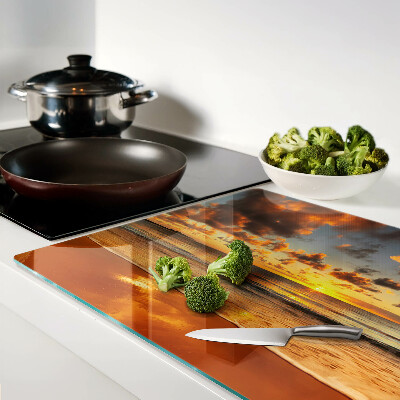 Glas schneidebrett Sonnenuntergang über dem Meer