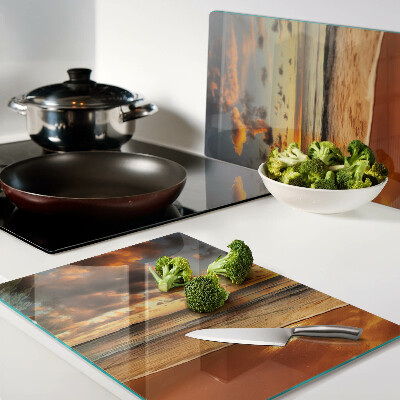 Glas-Schneidebrett mit Motiv ‚Sonnenuntergang über dem Meer‘