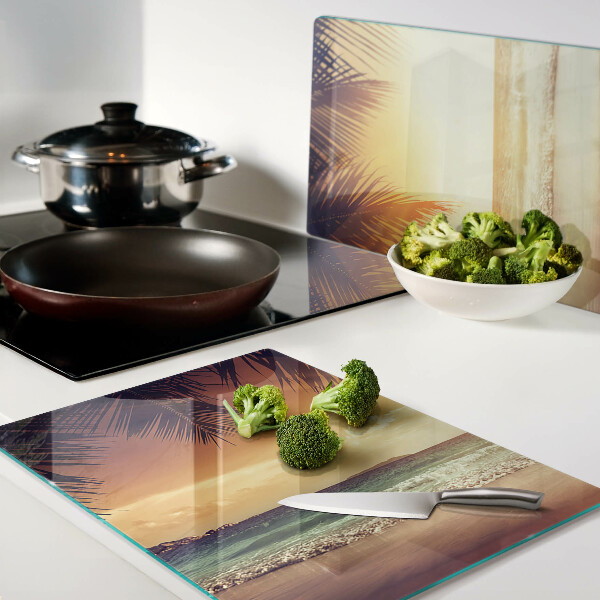 Glas schneidebrett Sonnenuntergang über dem Strand