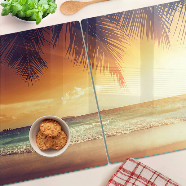 Glas schneidebrett Sonnenuntergang über dem Strand