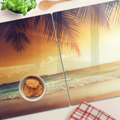 Glas schneidebrett Sonnenuntergang über dem Strand