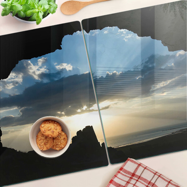 Glas schneidebrett Sonnenuntergang hinter den Wolken