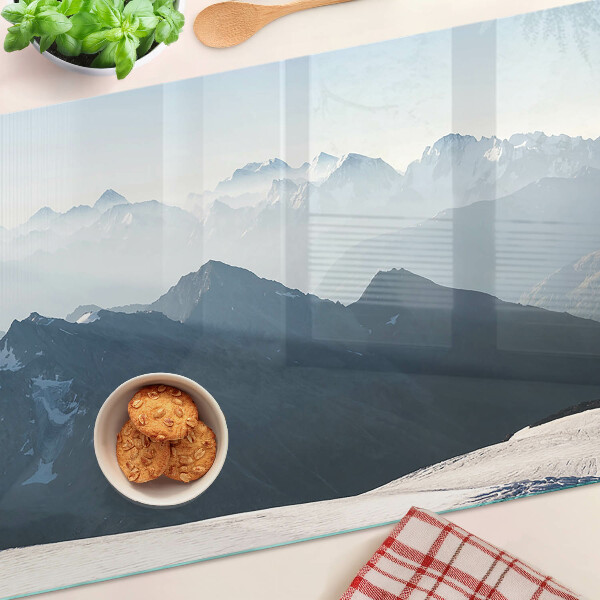 Glas-Schneidebrett mit Motiv einer Berglandschaft in den Wolken