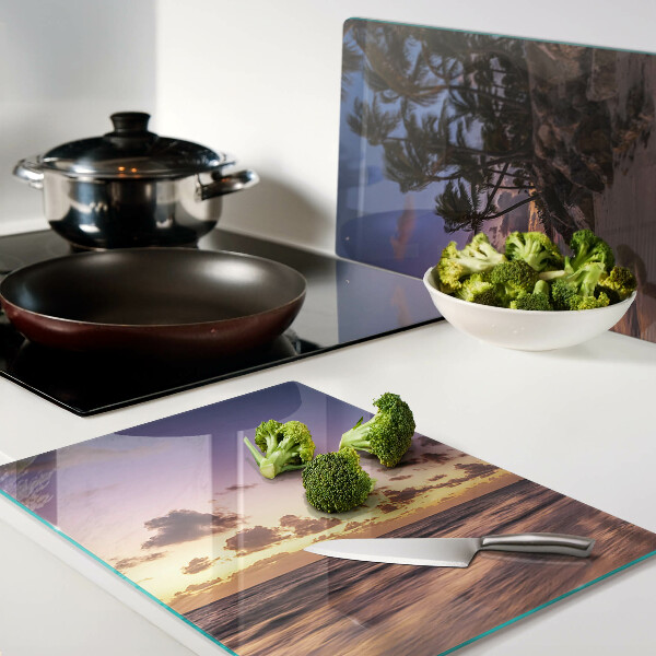 Schneidebrett mit Motiv 'Sonnenuntergang über dem Strand'