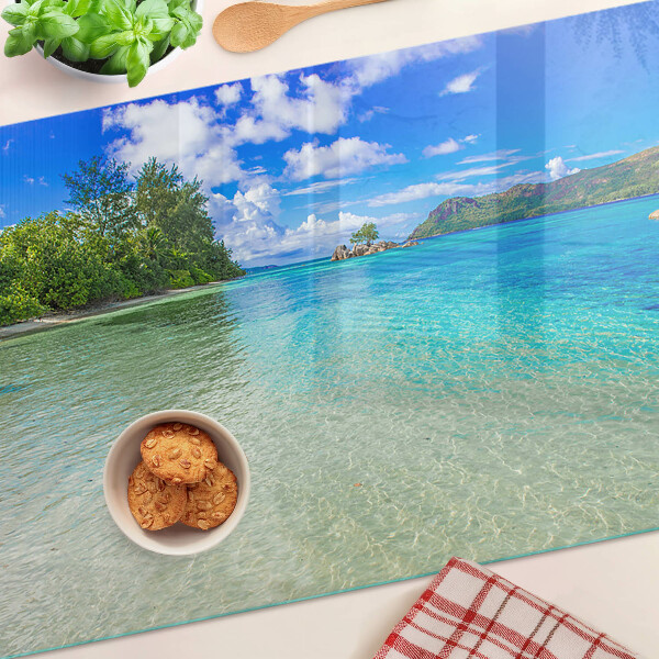 Glas-Schneidebrett mit Motiv eines tropischen Strandes und azurblauem Wasser