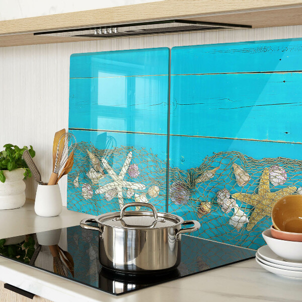 Schneidebrett mit Muschel- und Seesternmotiv in Netzoptik