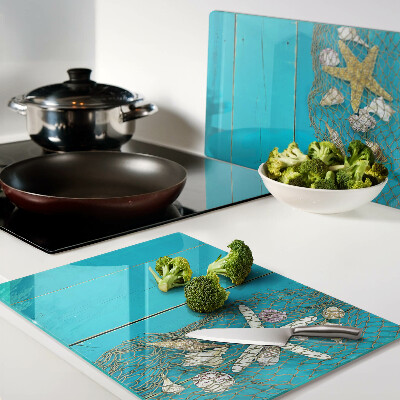 Schneidebrett mit Muschel- und Seesternmotiv in Netzoptik