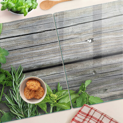 Glas schneidebrett Grüne Kräuter auf Holzgrund