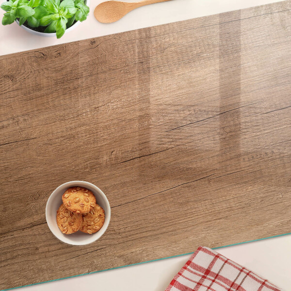 Glas-Schneidebrett mit Holzoptik und Fensterspiegelung