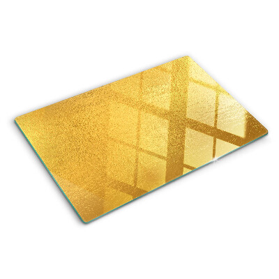 Glas schneidebrett Goldene Oberfläche mit Spiegelungen