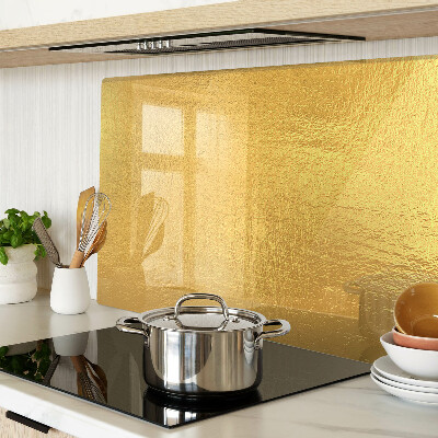 Glas-Schneidebrett mit goldfarbener, spiegelnder Oberfläche