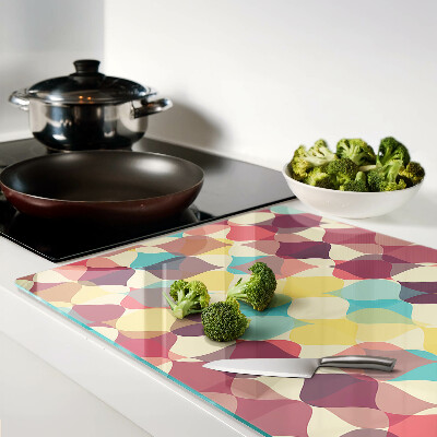 Schneidebrett mit einem geometrischen Muster aus farbigen Kreisen