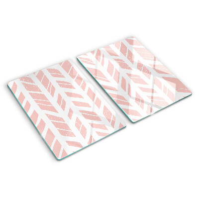 Glas-Schneidebrett mit Blättern in rosafarbenem Ton