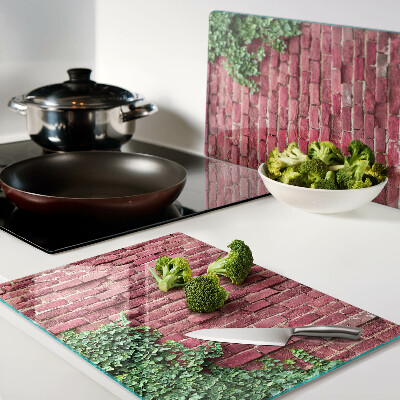 Schneidebrett glas Ziegelmauer mit Vegetation