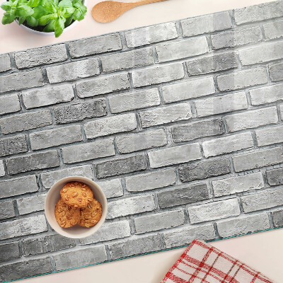 Schneidebrett Backsteinmauer in Grautönen