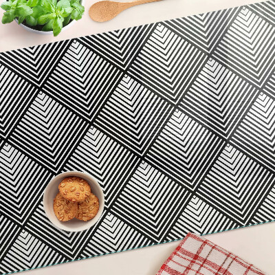 Glas-Schneidebrett mit schwarz-weißem geometrischem Motiv