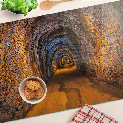Schneidebrett Glas mit Motiv eines beleuchteten Tunnels in einer Höhle