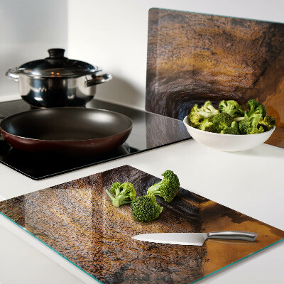 Schneidebrett Glas mit Motiv eines beleuchteten Tunnels in einer Höhle