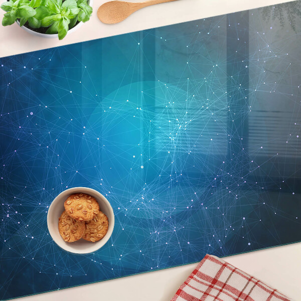 Glas-Schneidebrett mit einem Muster aus geometrischen Linien und Punkten