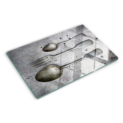 Schneidebrett Glas mit Besteckmotiv auf Betongrund