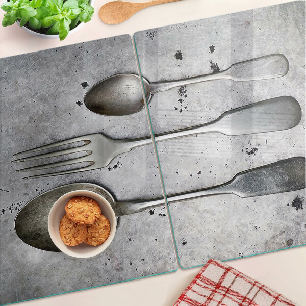Schneidebrett Glas mit Besteckmotiv auf Betongrund