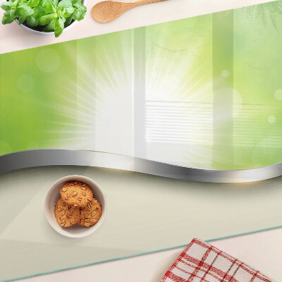 Glas schneidebrett mit grünem Bokeh-Motiv und Lichtstrahlen