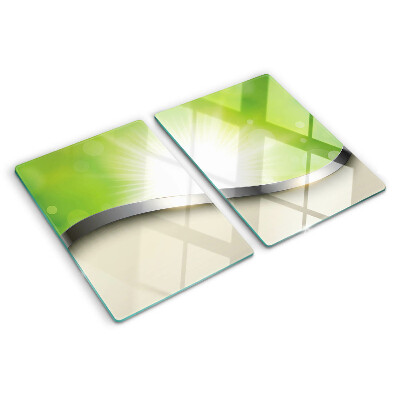 Glas schneidebrett mit grünem Bokeh-Motiv und Lichtstrahlen