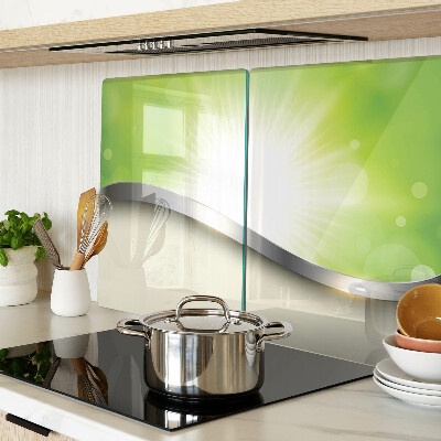 Glas schneidebrett mit grünem Bokeh-Motiv und Lichtstrahlen