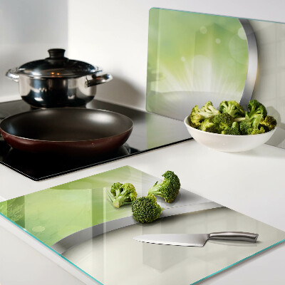 Glas schneidebrett mit grünem Bokeh-Motiv und Lichtstrahlen