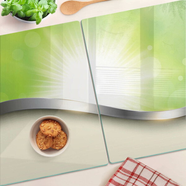 Glas schneidebrett mit grünem Bokeh-Motiv und Lichtstrahlen